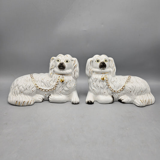 Pair of Recumbent Staffordshire Dog Sculptures