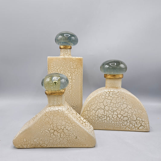 Three Antiqued Glass Decorator Bottles