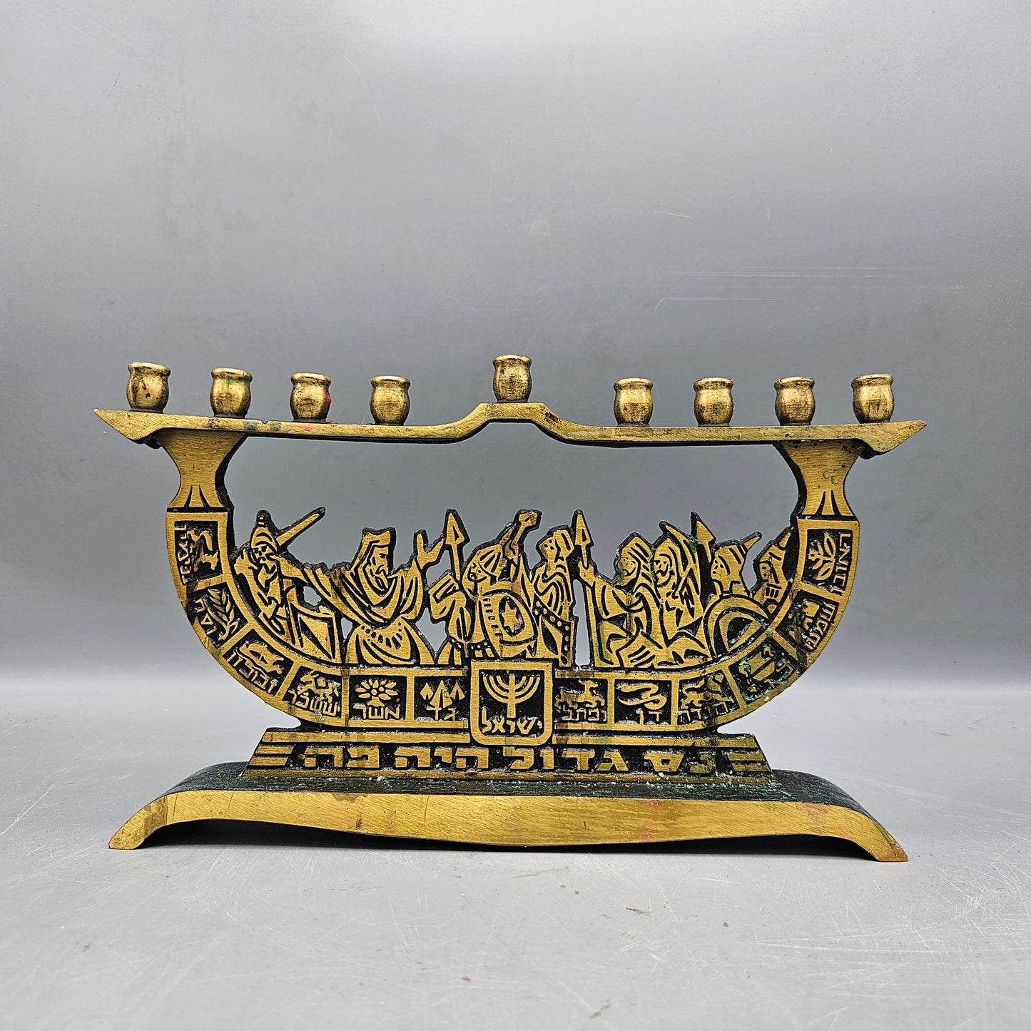 1950's Brass Patina Menorah with Intricate Battle Scene